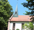 Ev. Martin-Luther-Kirche am Eingang zum Schlopark (Hugst.)